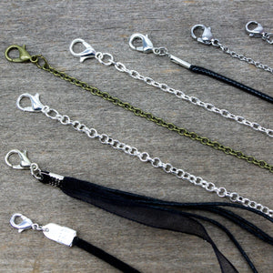 display of varirty necklace chains with religious pendants