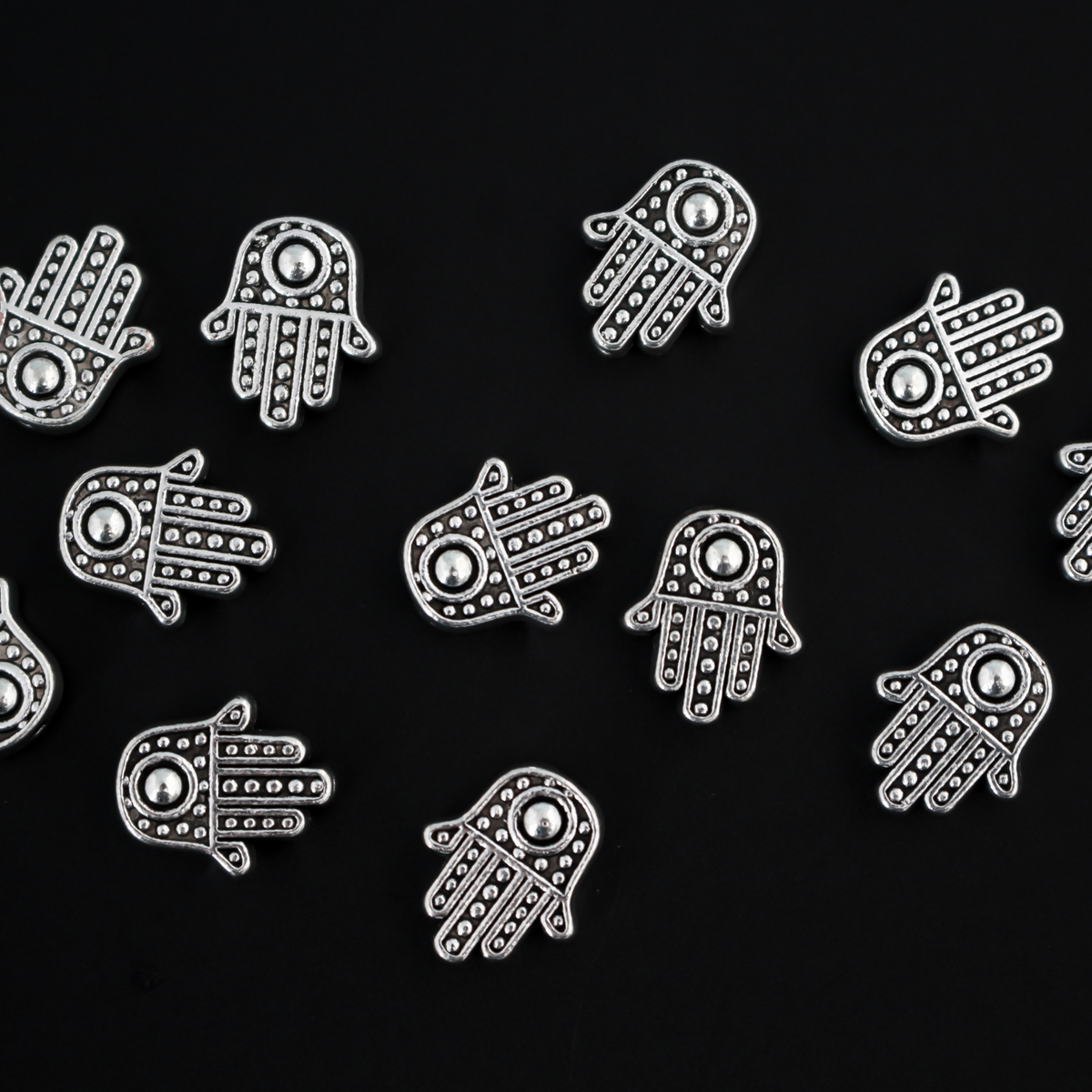 antiqued silver tone hamsa hand beads that are 12mm long by 10mm wide with 1.5mm hole