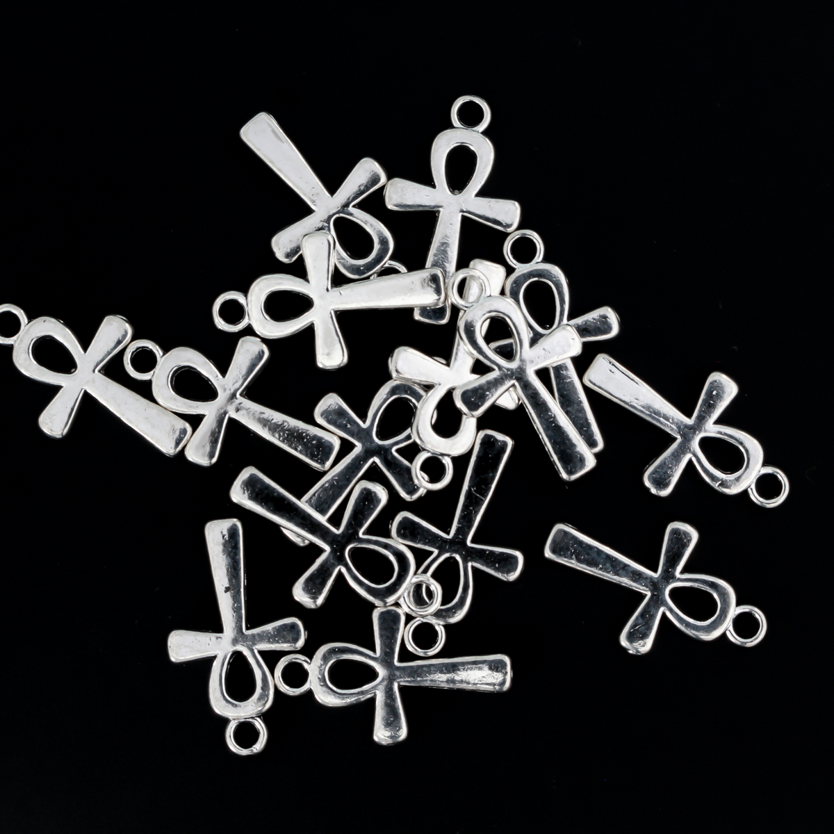 Egyptian Ankh cross charms that are a zinc alloy base with a shiny silver plating
