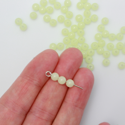Luminous glow in the dark acrylic beads that are center drilled. They are a light pale green color when viewed in daylight. They glow green in the dark