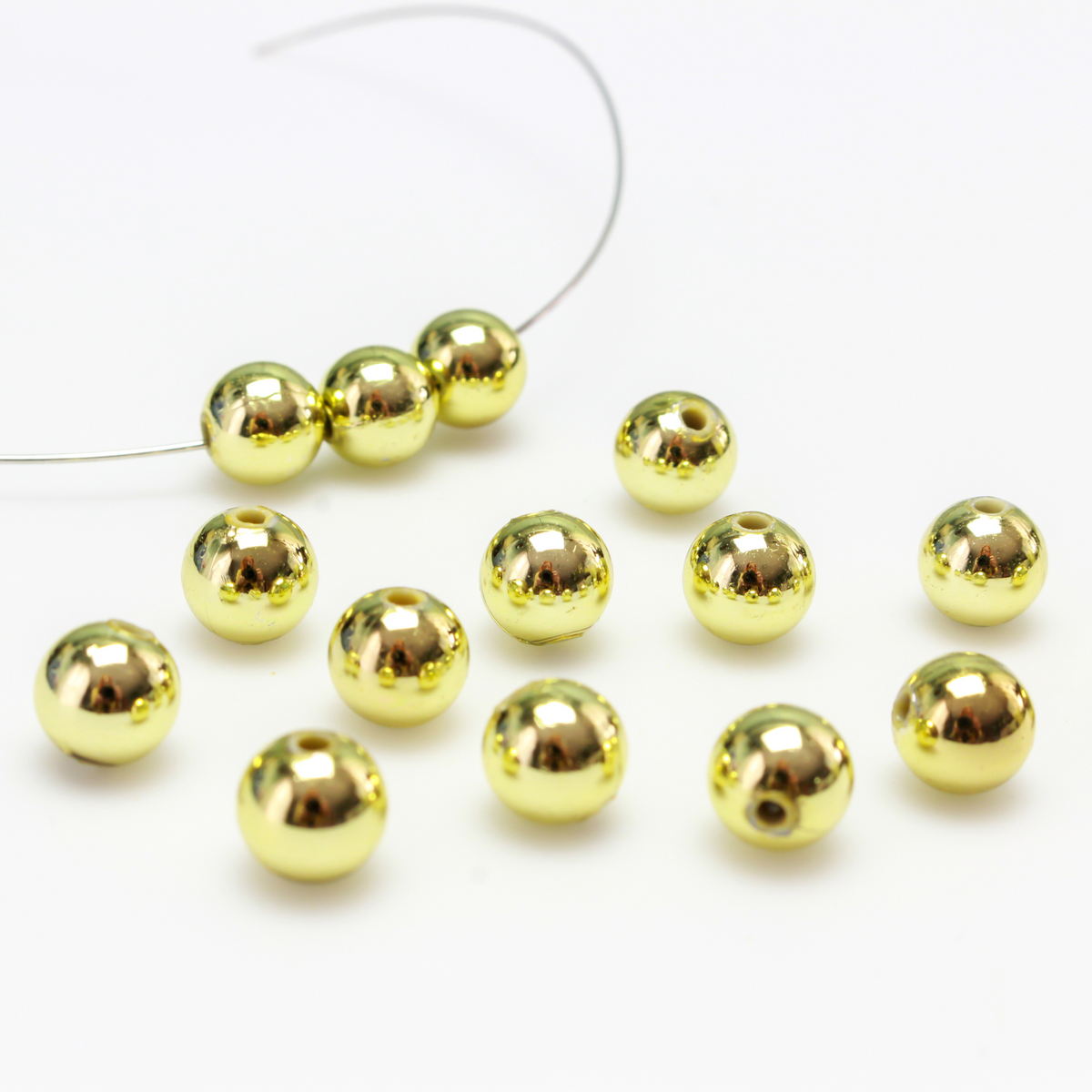 8mm round plastic beads with a gold metallic plating.