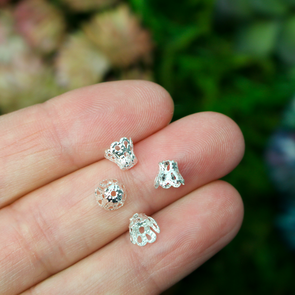 Filigree bead cap cups that are 5mm long by 6mm in diameter at the opening. They can fit beads 6mm - 8mm