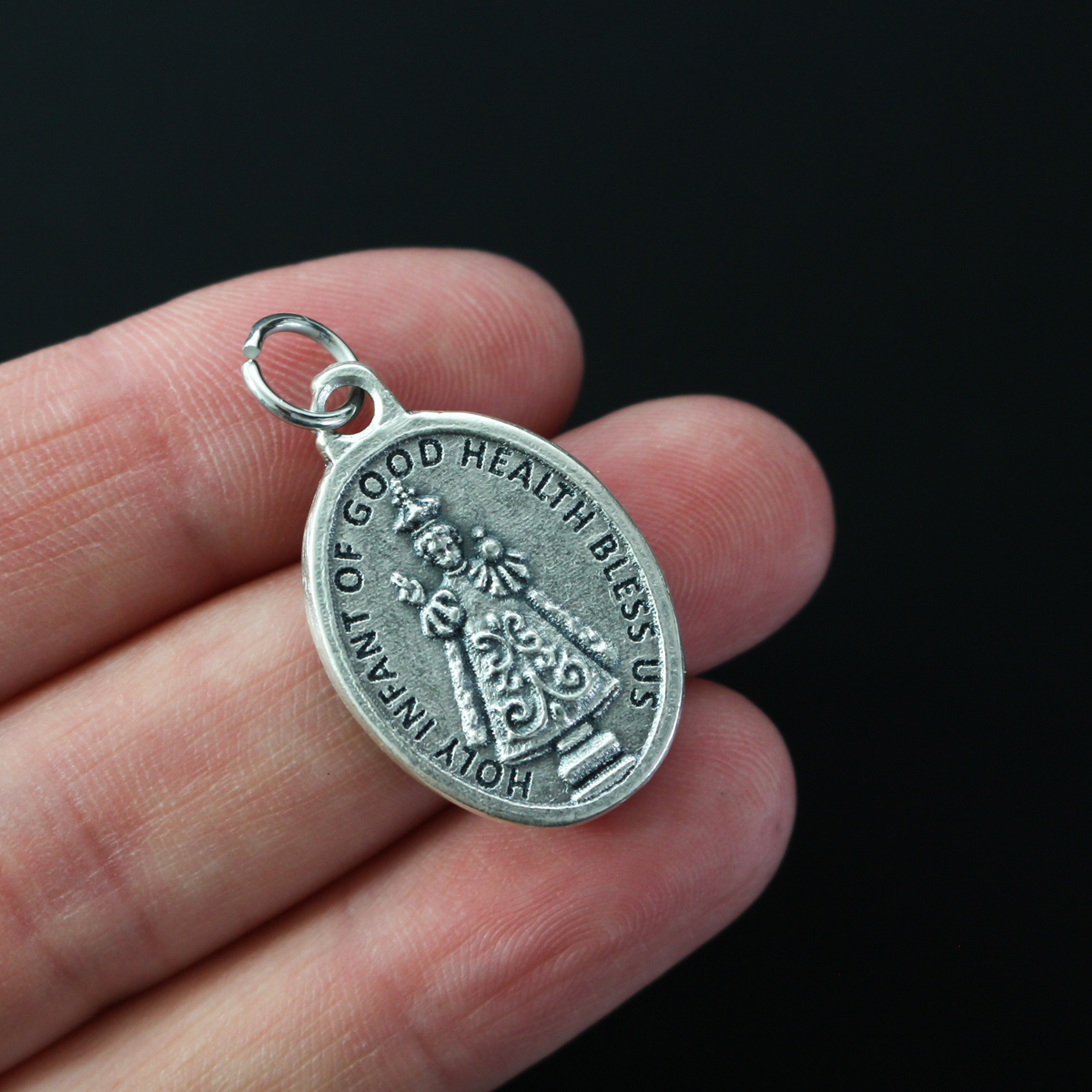 Mary, Comfort of the Sick medal with the Holy Infant Jesus of Good Health on the backside