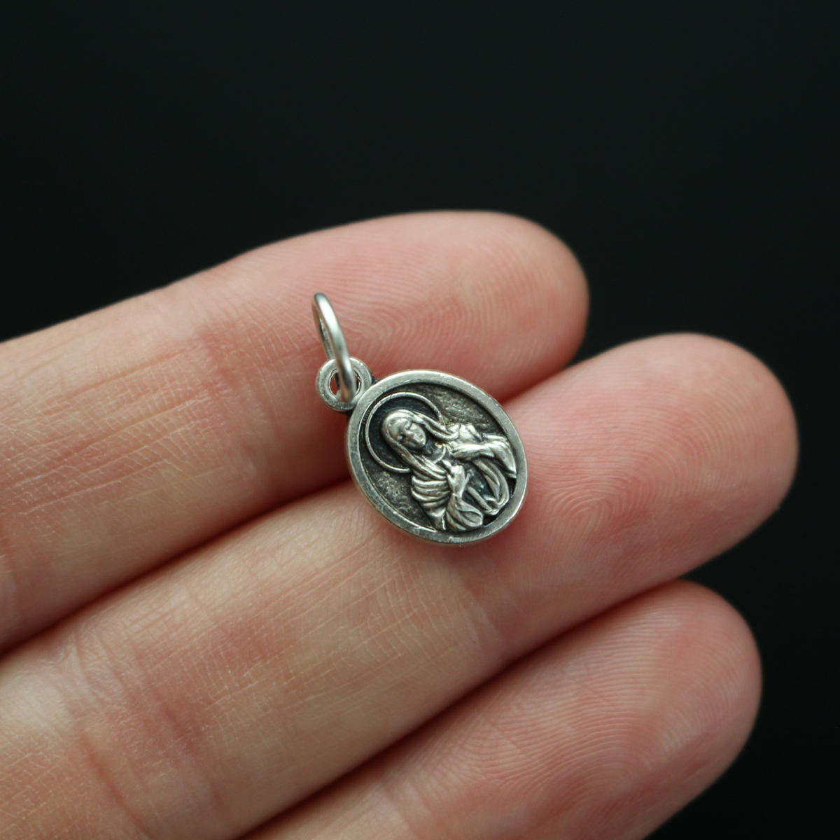 small, beautifully detailed version of the Immaculate Heart of Mary medal that depicts the Sanctuary of Tears on the reverse side