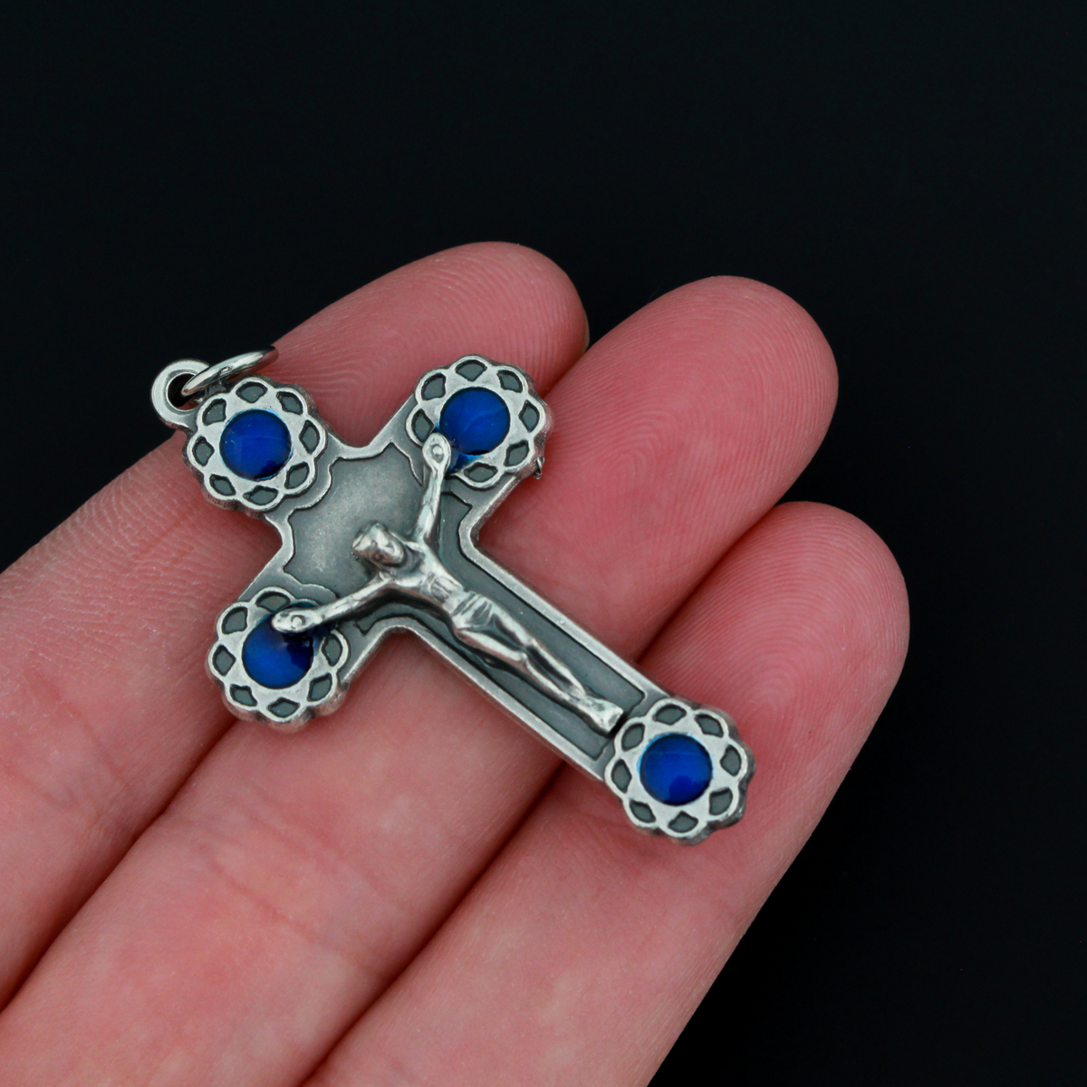 Crucifix cross with blue enamel flowers at the ends. This beautifully detailed cross is handmade in Italy and is 1-11/16" long
