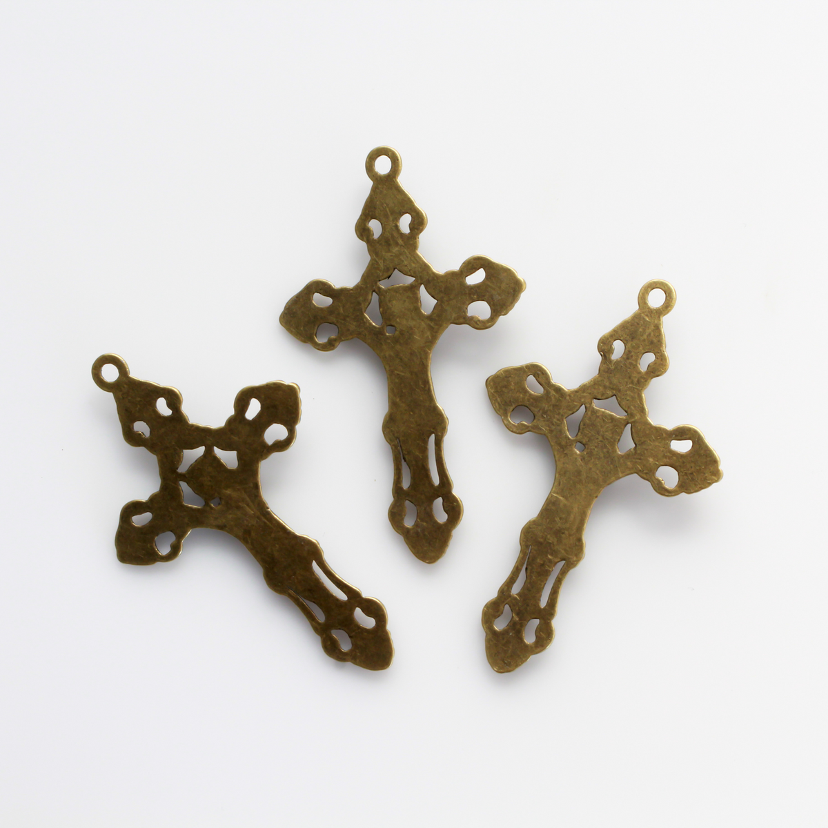 Three ornate fleur de lis crucifix cross in an antiqued bronze color and filigree cut out design, 2-1/8" long
