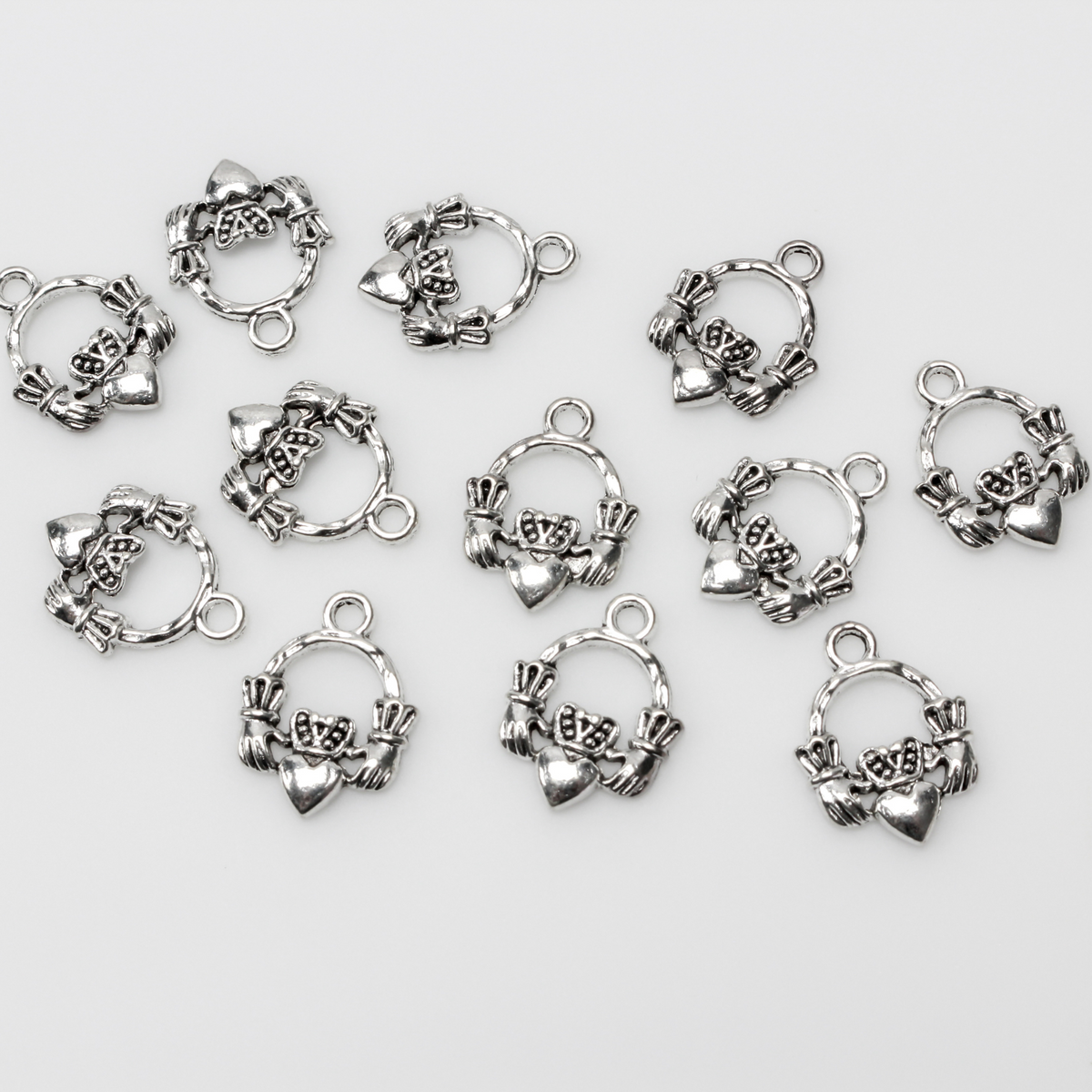 Irish Claddagh symbol charms in an antiqued silver finish, 18mm long