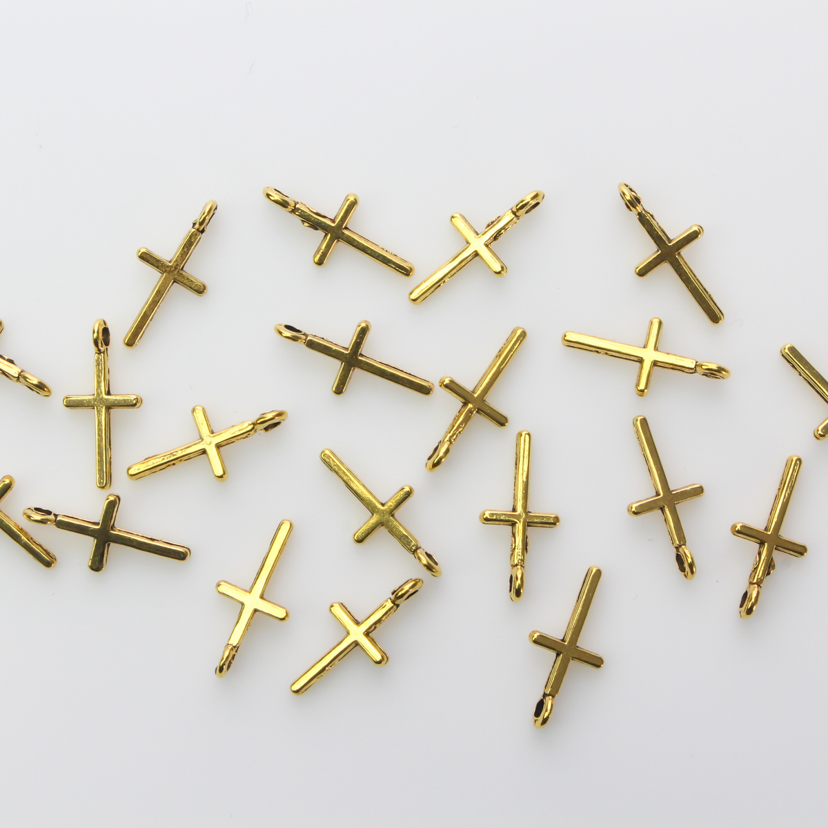 simple gold-tone cross charm 17mm long