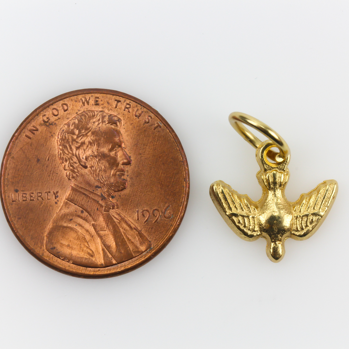Gold-tone holy spirit dove charm with nice detail.