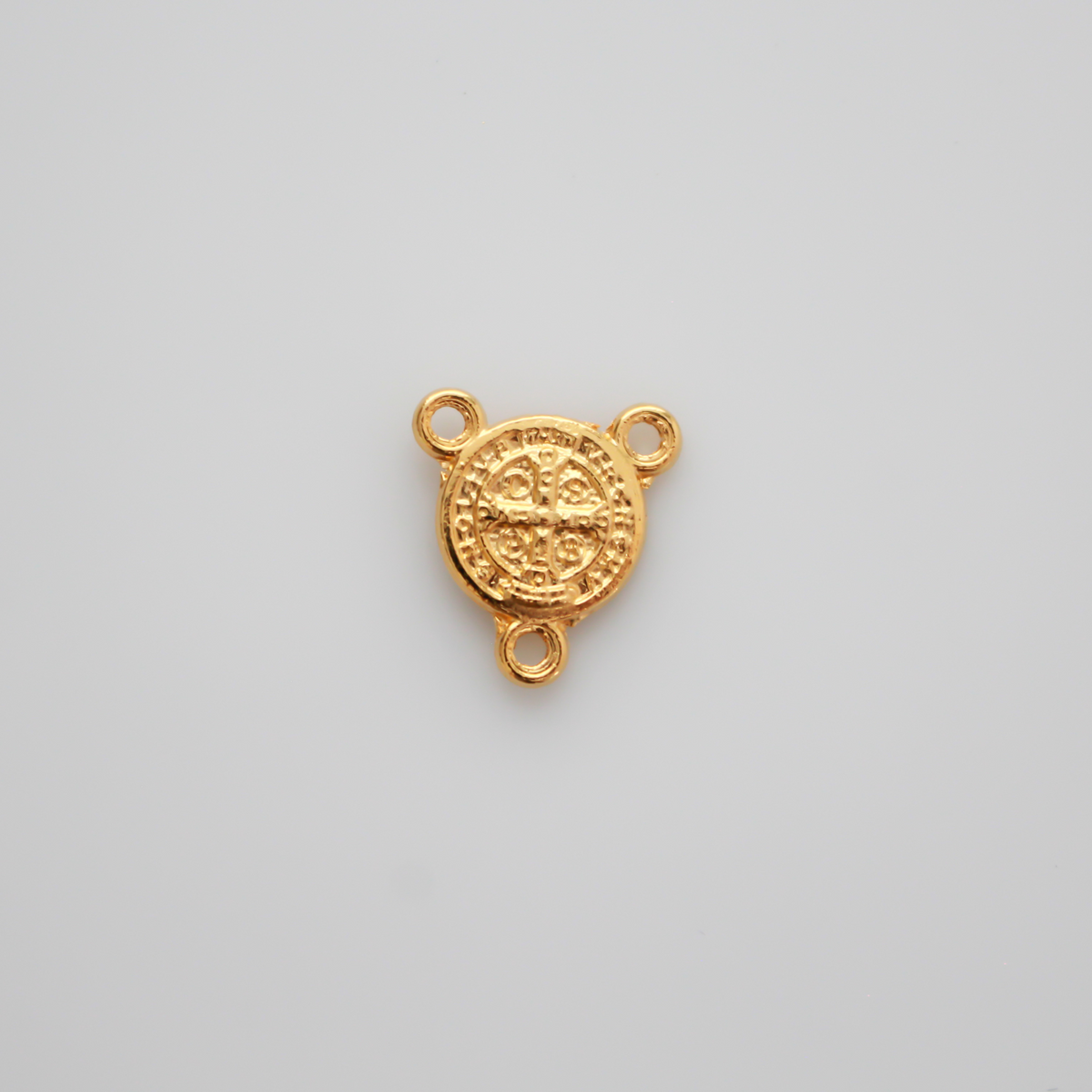 Tiny gold tone Saint Benedict Crucifix rosary centerpiece, 1/2" long.