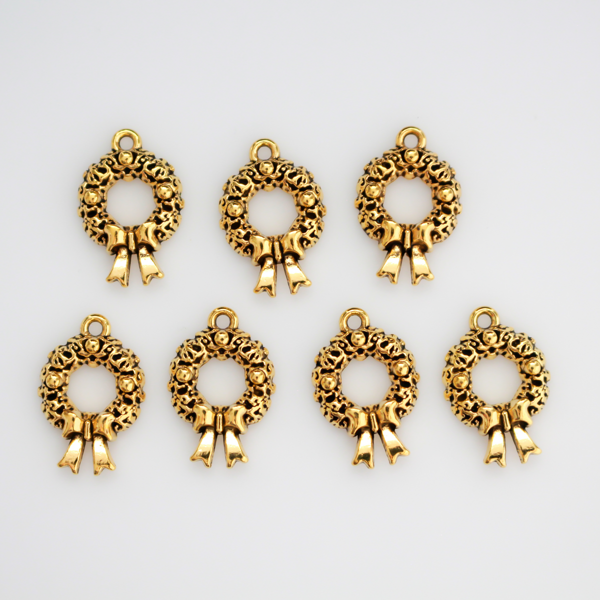 Gold tone Christmas wreath charms, 19mm long