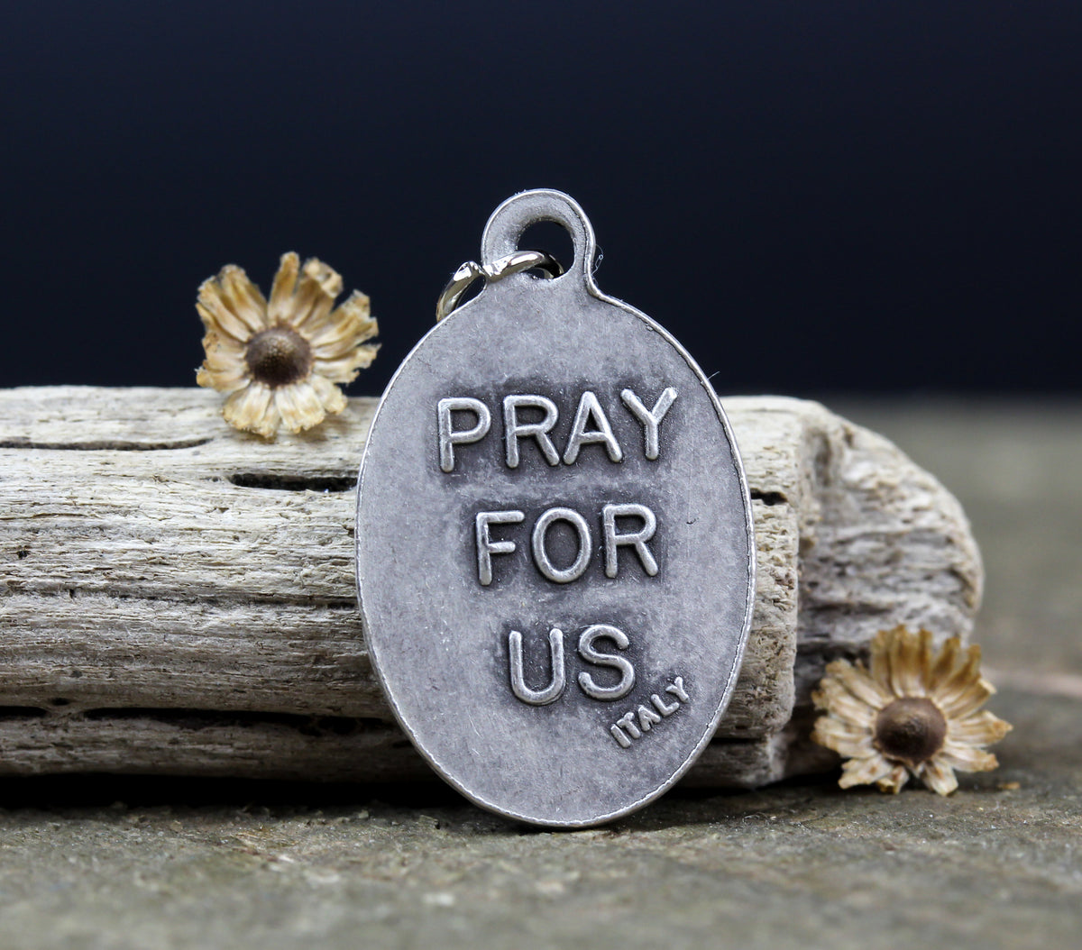 die cast silver medal inscribed with pray for us