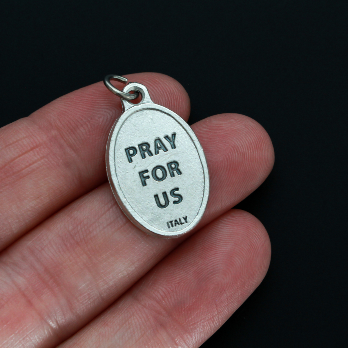 Saint Louis de Montfort medal that depicts the saint on the front and "Pray for us" on the back
