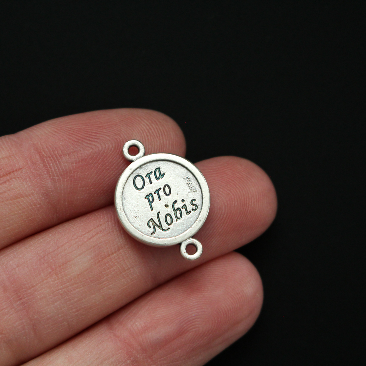 St. Therese of Lisieux round flat connector links that are silver oxidized plating on a base metal 20mm x 14mm