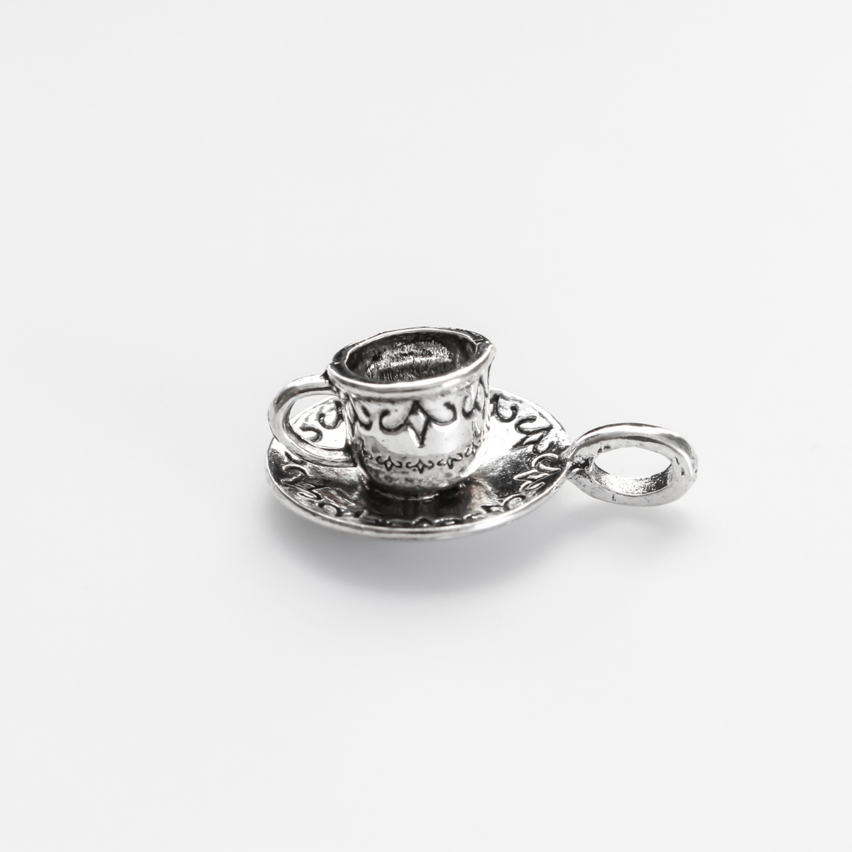 Tiny silver tone cup on a saucer charm. Perfect for coffee or tea lovers! *Necklace is not included*