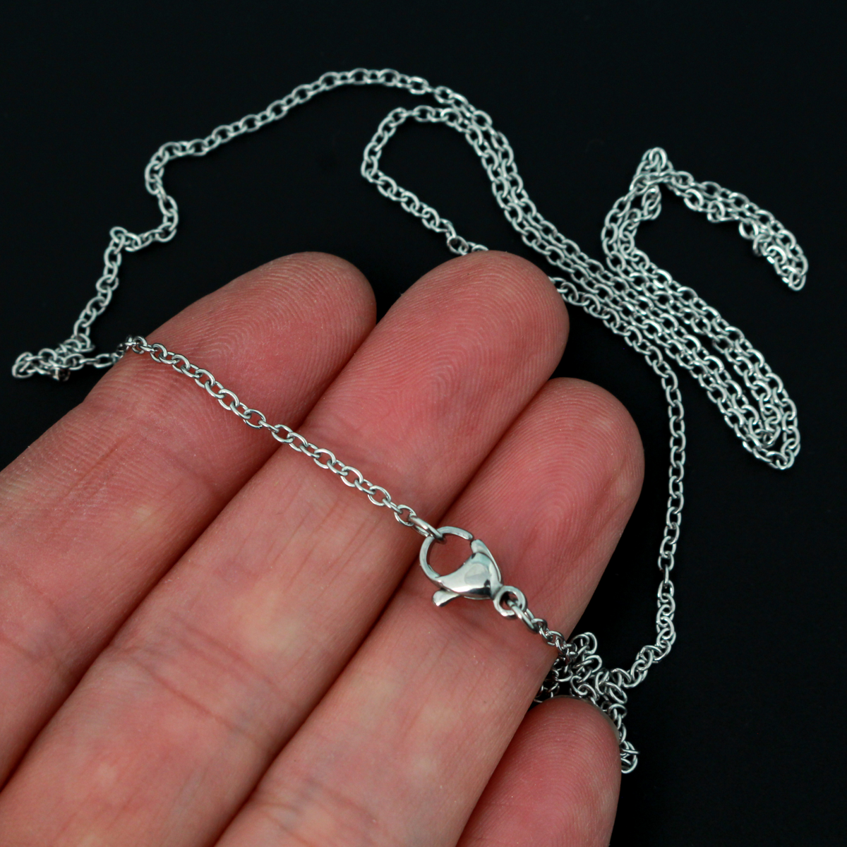 Stainless steel link cable chain necklace that features a lobster claw clasp for easy opening, 50cm long