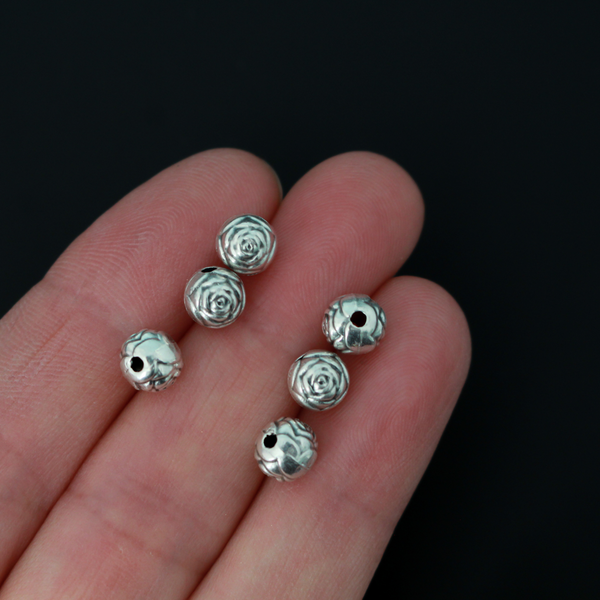 Antiqued silver-tone metal beads with a rosebud pattern, perfect for rosaries, chaplets, bracelets, e