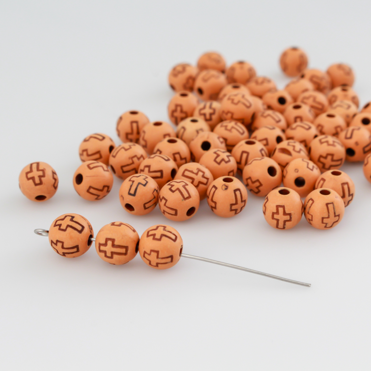 Acrylic imitation wood round beads that are 8mm with a 2mm hole size