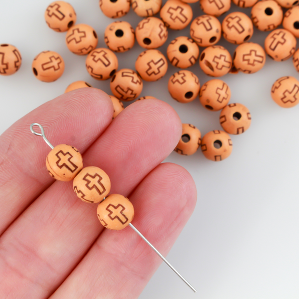 Acrylic imitation wood round beads that are 8mm with a 2mm hole size