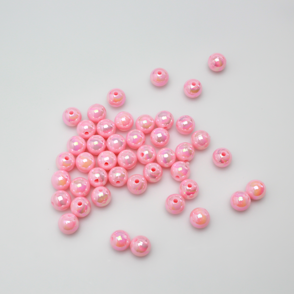 8mm round pink beads that are AB plated (Aurora Borealis) giving them a iridescent metallic look.