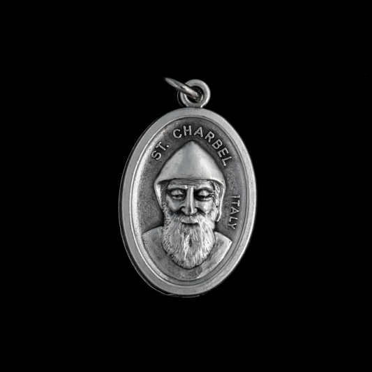 Saint Charbel medal that depicts the saint on the front and is marked "Pray For Us" on the backside.