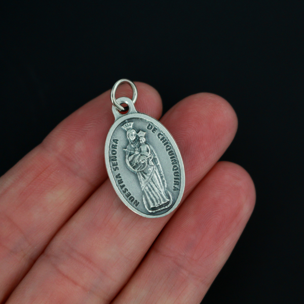 Our Lady of Chiquinquirá medal that depicts Our Lady on the front and is marked "Pray For Us" on the back