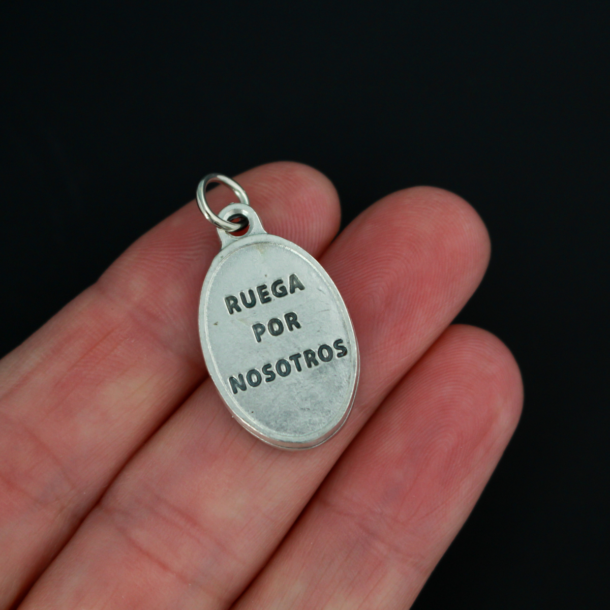 Our Lady of Chiquinquirá medal that depicts Our Lady on the front and is marked "Pray For Us" on the back