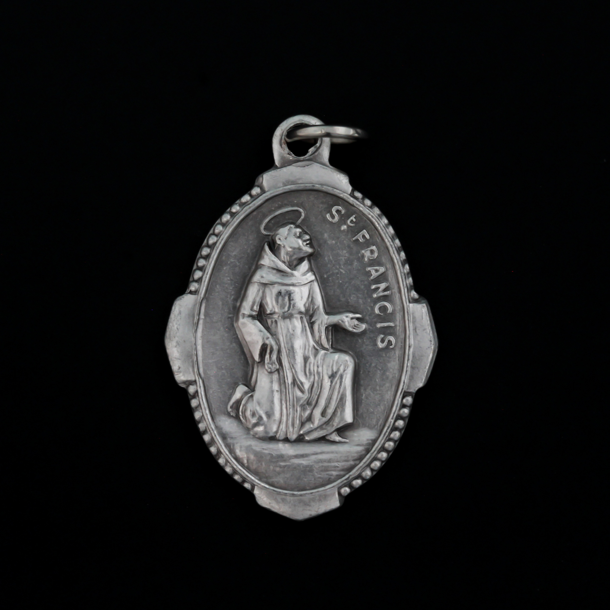 Saint Francis of Assisi medal with deluxe ornate border that depicts the saint on the front and "Pray For Us" on the back