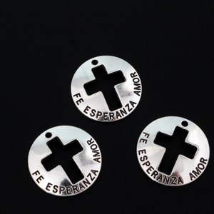 Fe, Esperanza, Amor - Spanish for Faith, Hope, Love. These charms are round with a slight curve and a cut out cross in the center