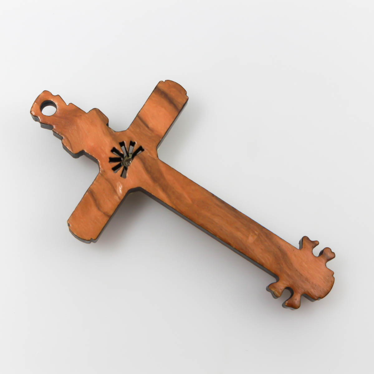 The cross is made of genuine olive wood and the body of Christ is a zamac base alloy with genuine oxidized silver-plating. There is a cutout starburst design behind the head of Jesus and the Golgotha skull at the base of the cross.