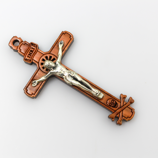 The cross is made of genuine olive wood and the body of Christ is a zamac base alloy with genuine oxidized silver-plating. There is a cutout starburst design behind the head of Jesus and the Golgotha skull at the base of the cross.