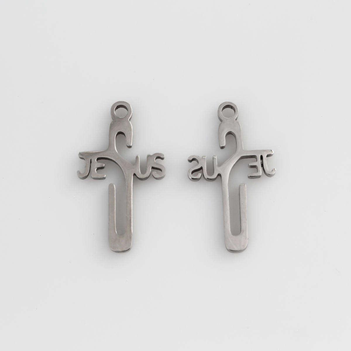 Jesus cross pendant with His name spelled out in the shape of a cross.