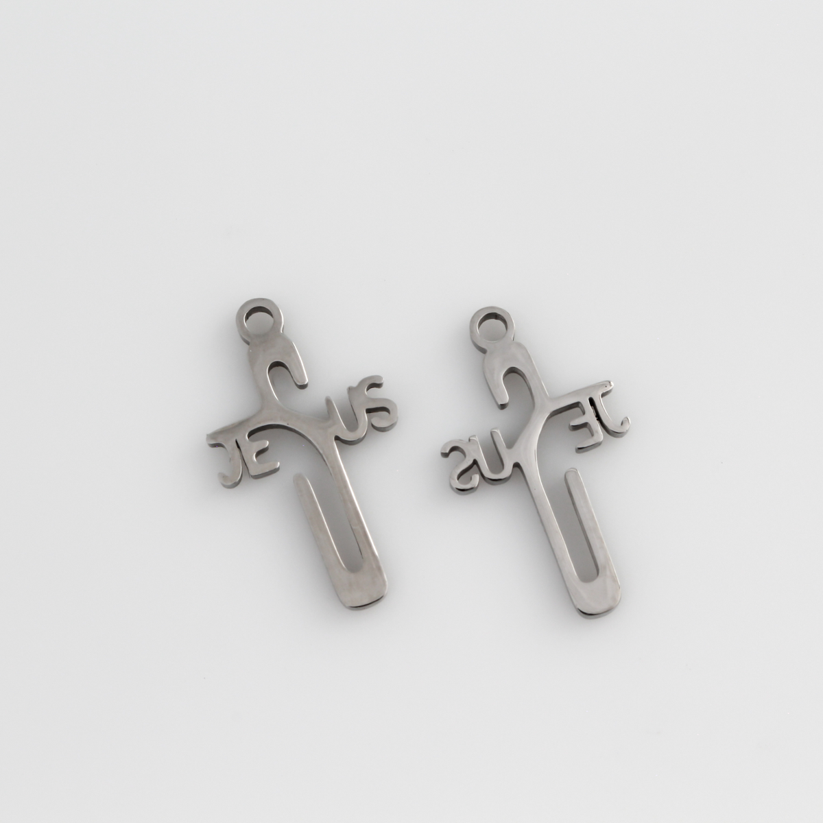 Jesus cross pendant with His name spelled out in the shape of a cross.