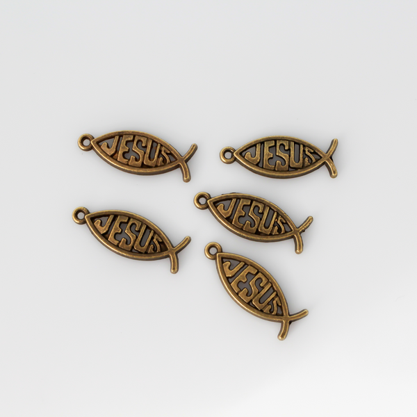 27mm long bronze-tone Fish-shaped charm with Jesus spelled out in the center