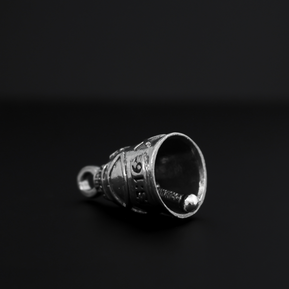 John 3:16 Guardian bell that is marked "John 3:16" and is surrounded by fish symbols also known as the Ichthys, a symbol for Jesus.