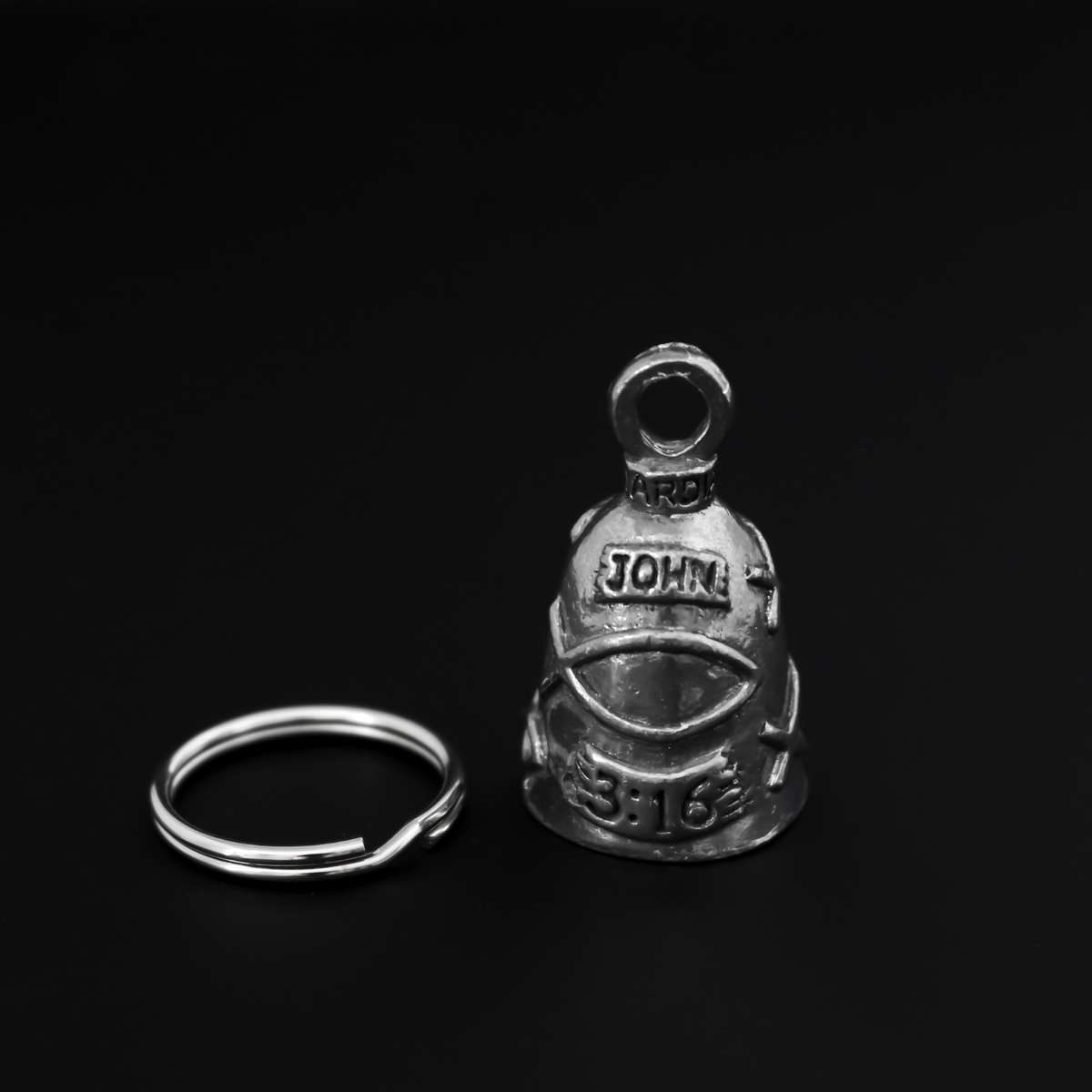 John 3:16 Guardian bell that is marked "John 3:16" and is surrounded by fish symbols also known as the Ichthys, a symbol for Jesus.