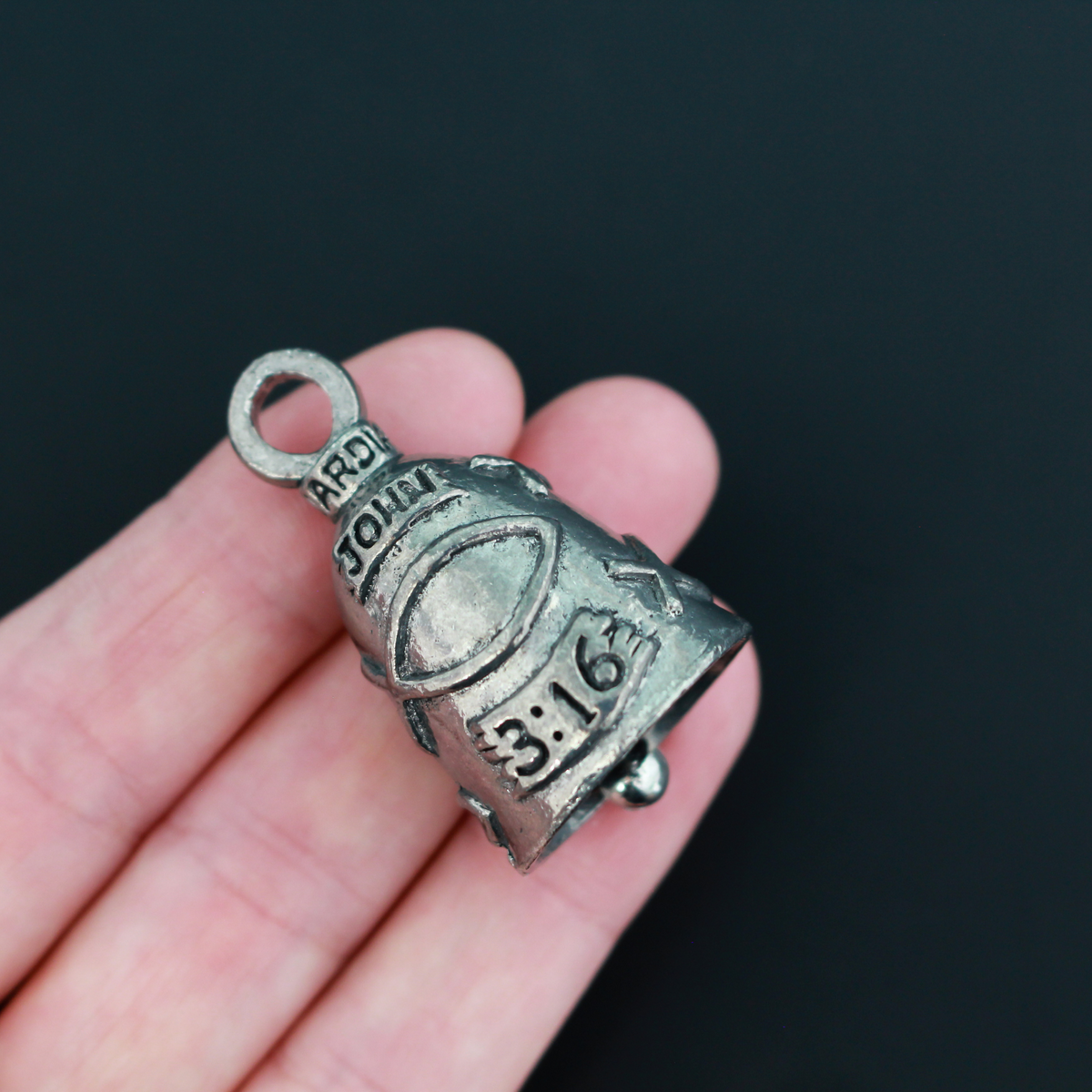 John 3:16 Guardian bell that is marked "John 3:16" and is surrounded by fish symbols also known as the Ichthys, a symbol for Jesus.