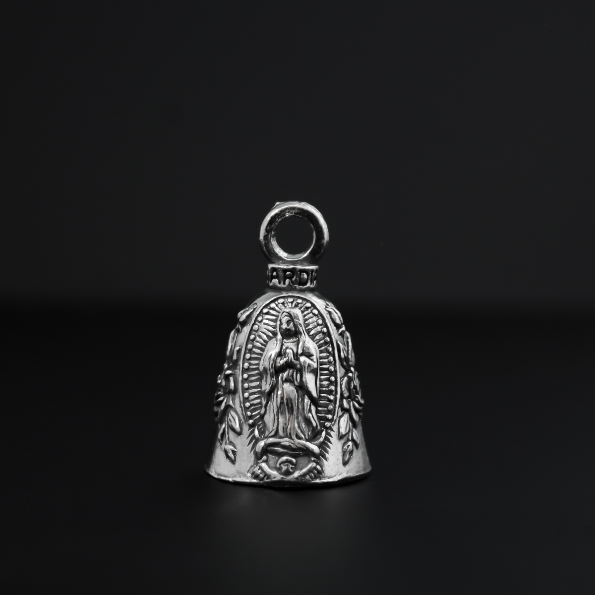 Our Lady of Guadalupe Guardian bell that depicts the Virgin Mary flanked by roses on either side.