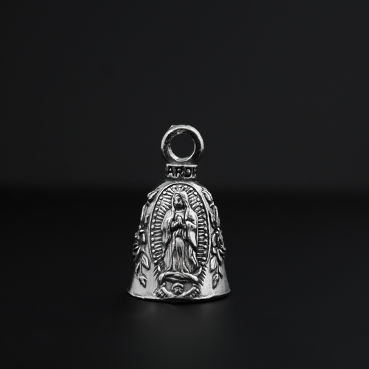 Our Lady of Guadalupe Guardian bell that depicts the Virgin Mary flanked by roses on either side.