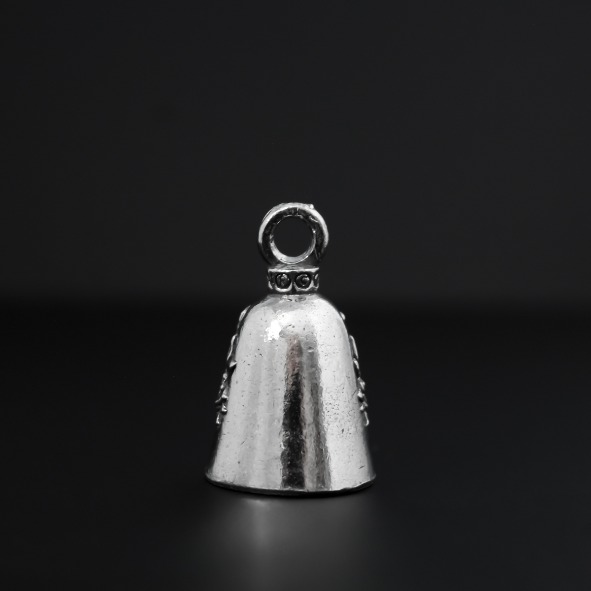 Our Lady of Guadalupe Guardian bell that depicts the Virgin Mary flanked by roses on either side.
