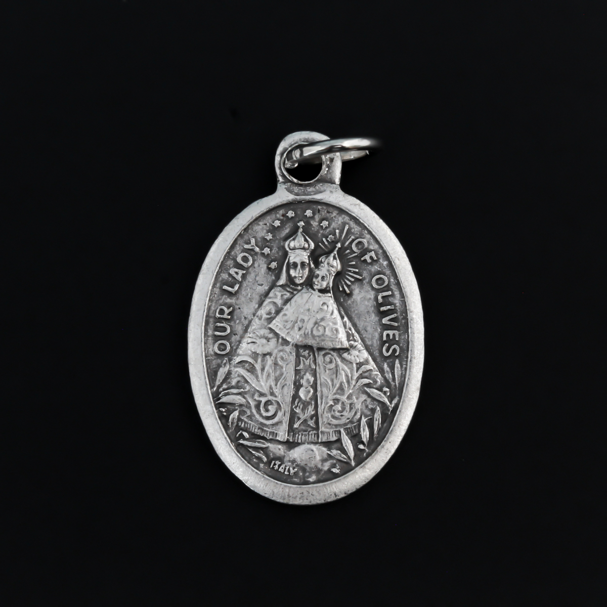 Our Lady of Olives medal that depicts the Blessed Virgin on the front and the Sacred Heart of Jesus on the back