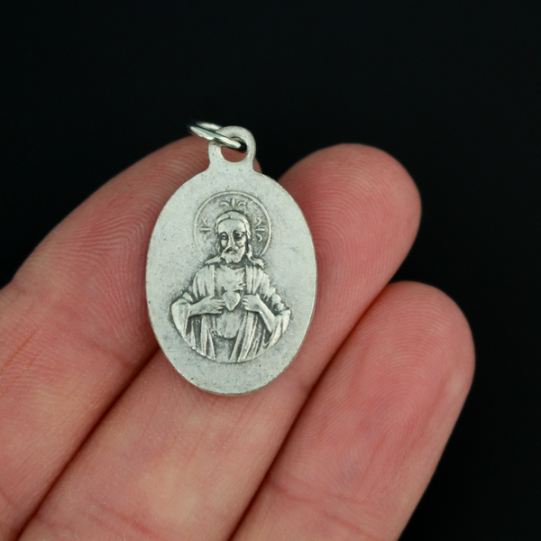 Our Lady of Olives medal that depicts the Blessed Virgin on the front and the Sacred Heart of Jesus on the back