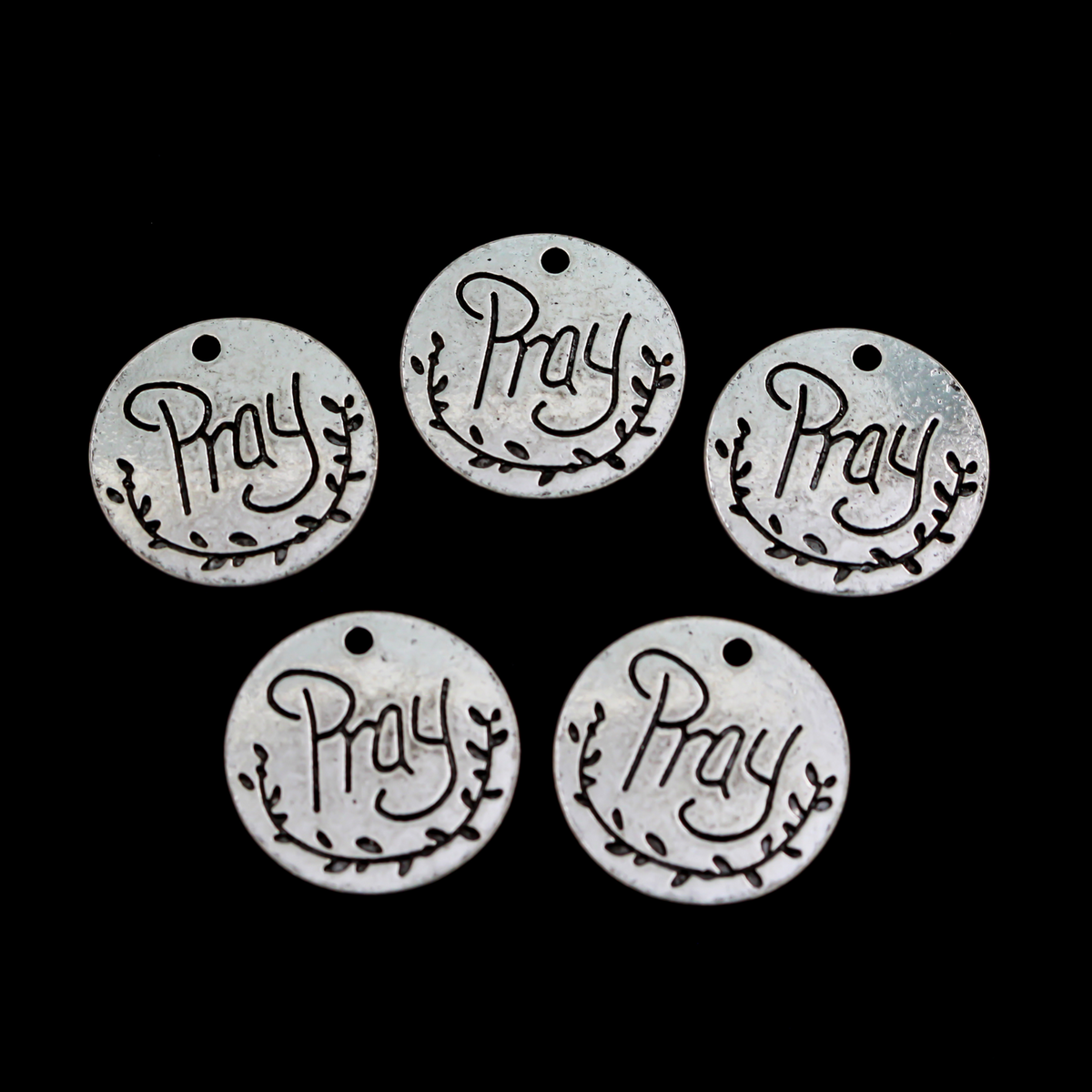 Flat, 20mm round charms engraved with the word "PRAY" with an olive branch detail beneath