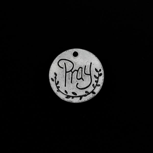 Flat, 20mm round charms engraved with the word "PRAY" with an olive branch detail beneath