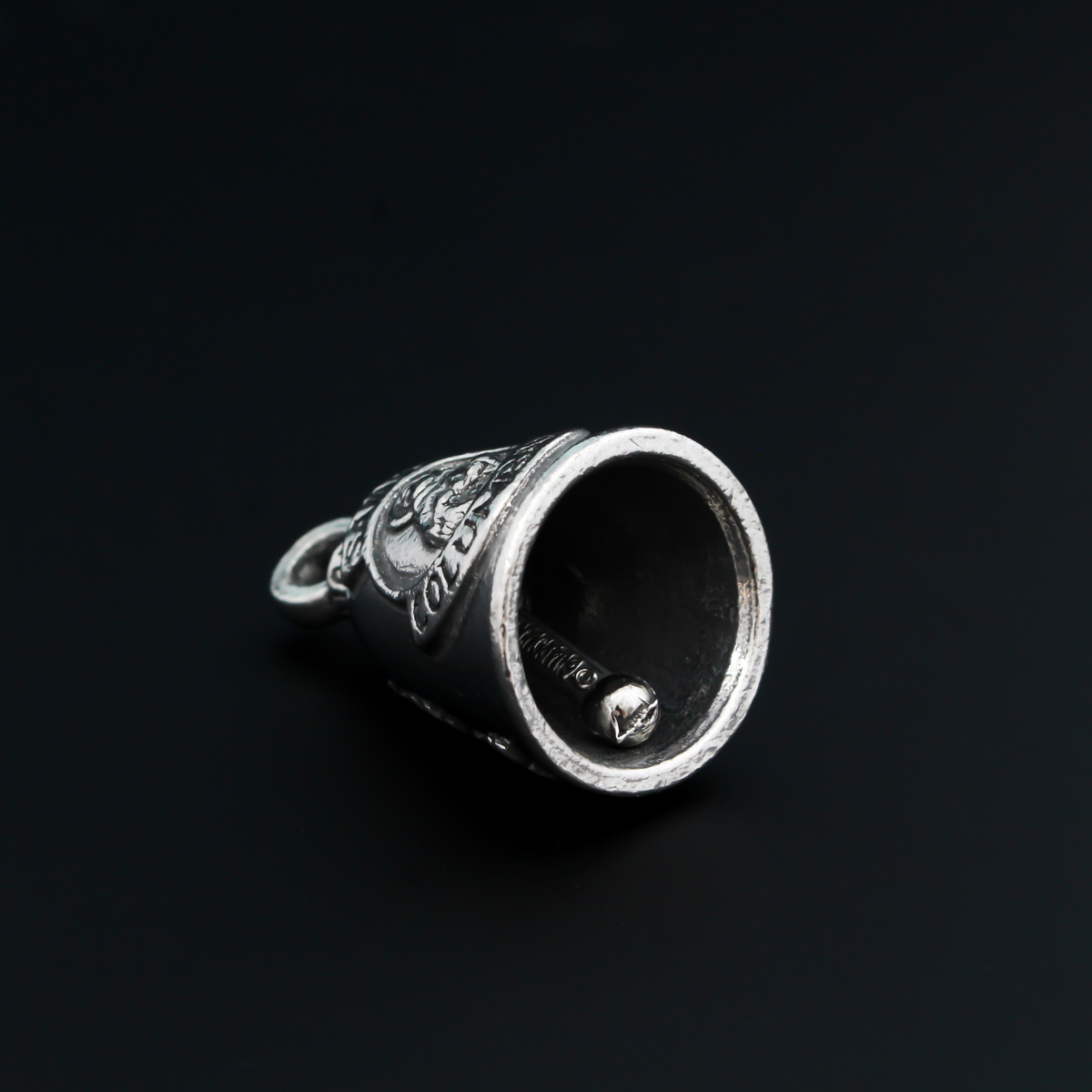 Saint Columbanus Guardian bell that depicts the saint on the front and is marked "Patron Saint of Motorcyclists" on the back.