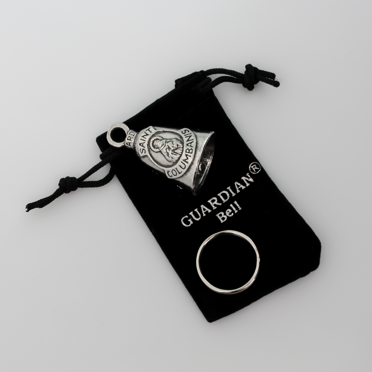 Saint Columbanus Guardian bell that depicts the saint on the front and is marked "Patron Saint of Motorcyclists" on the back.
