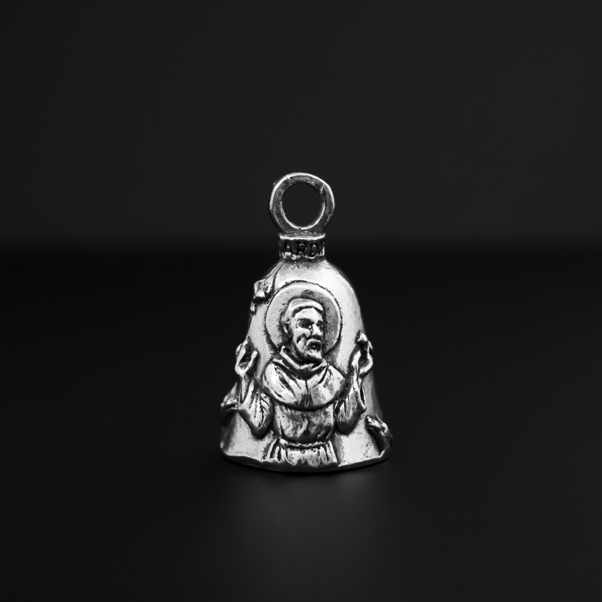 Saint Francis of Assisi Guardian bell that depicts the saint on the front and is marked "Saint Francis" on the back