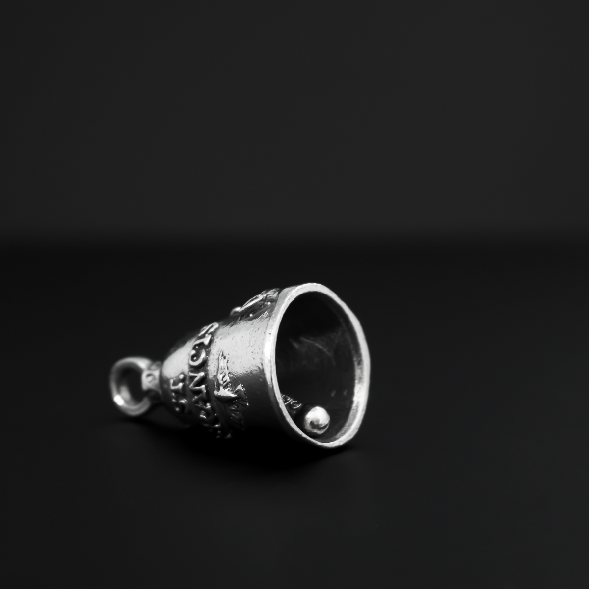 Saint Francis of Assisi Guardian bell that depicts the saint on the front and is marked "Saint Francis" on the back