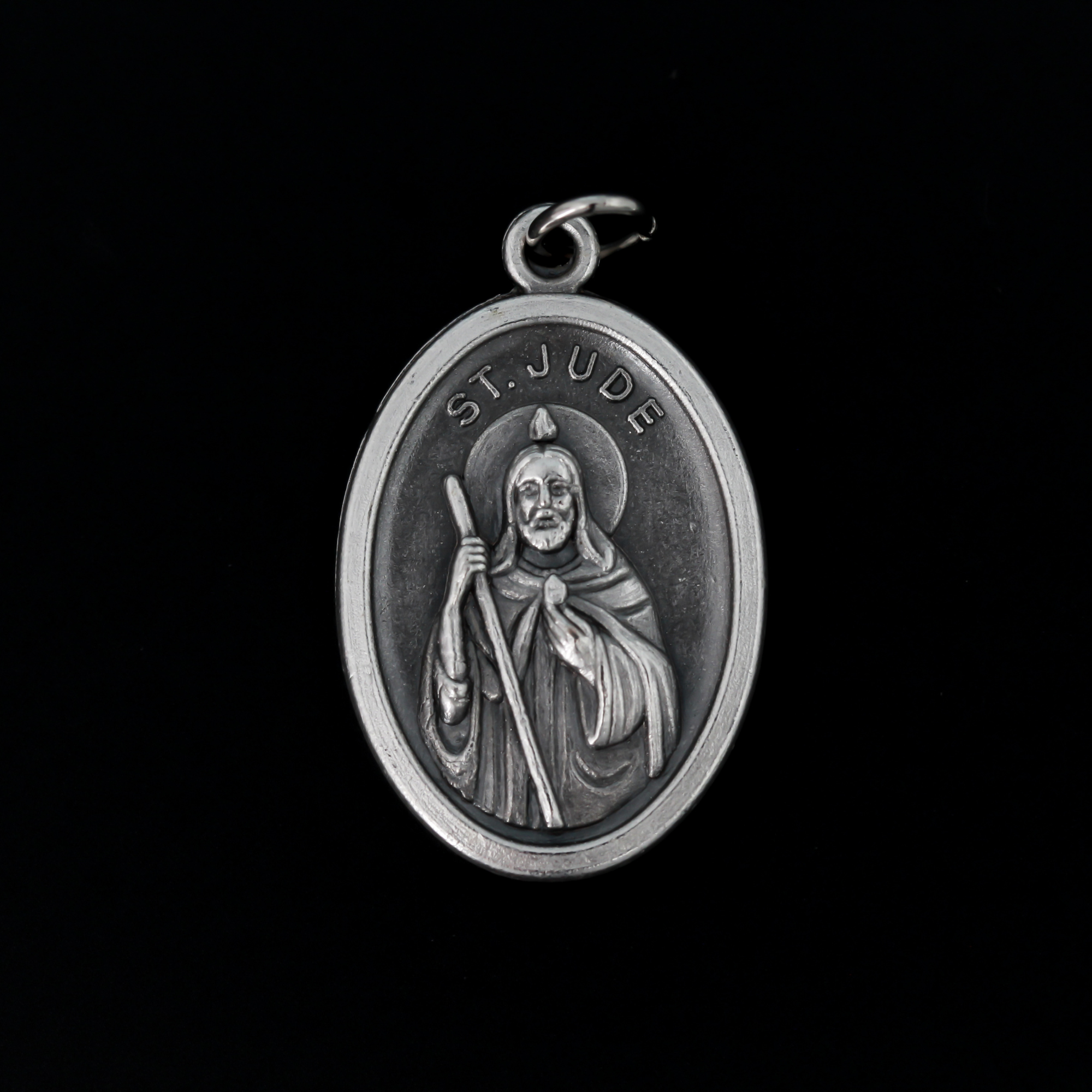 Saint Jude oval medal that depicts the saint on the front and "Pray For Us" on the back