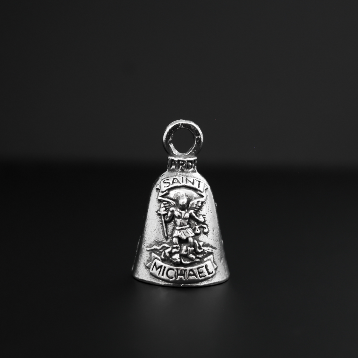 Saint Michael Guardian bell that depicts the saint on the front and is marked "Patron Saint of Law Enforcement" on the back
